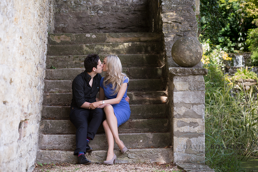 Le manoir engagement shoot kissing on steps