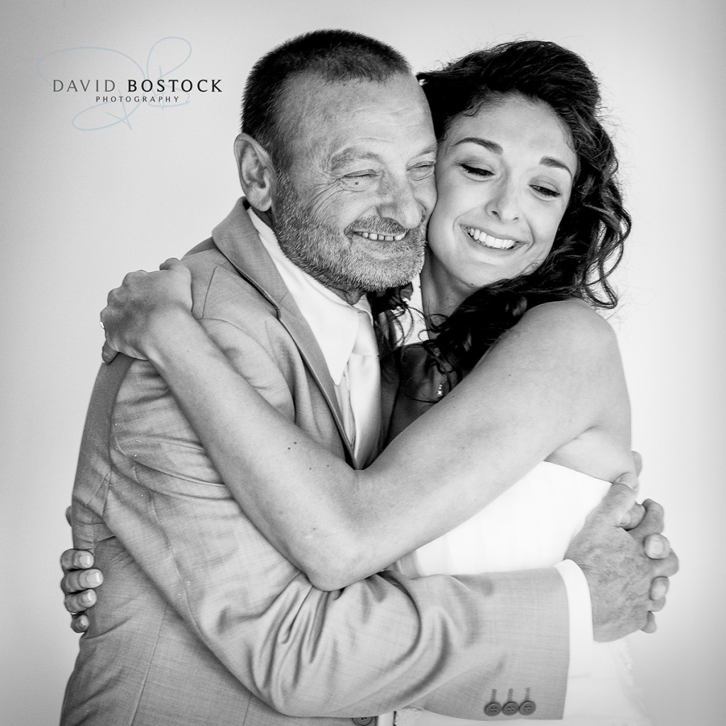 father hugging his daughter on her wedding day