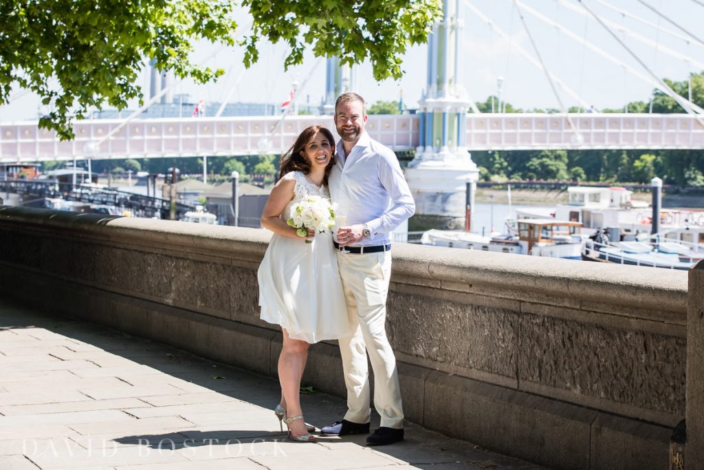 couple in front of chelsea bridge