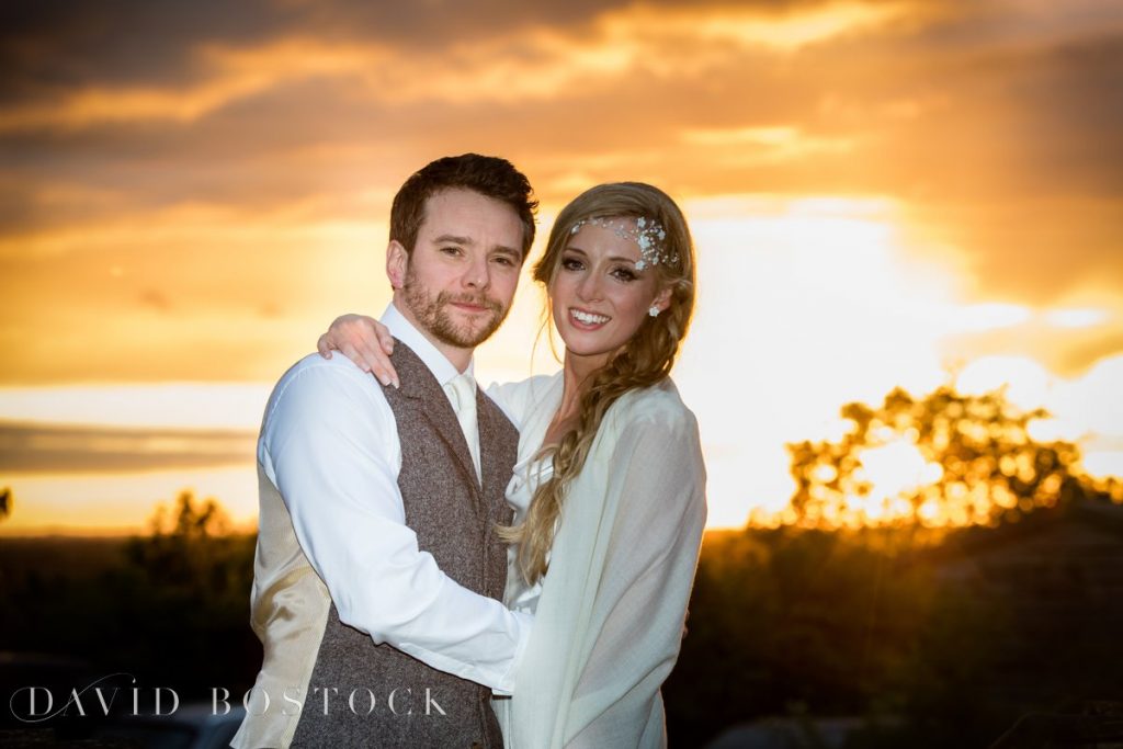 couple with sunset behind