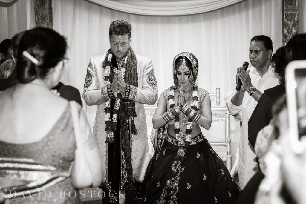 bride and groom pray