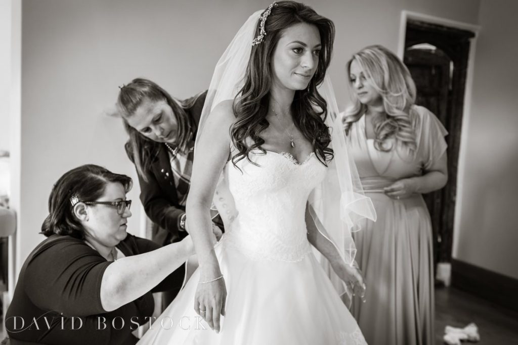 bride putting dress on