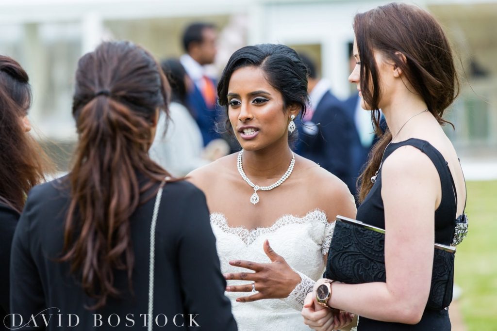 Eynsham Hall Wedding bride talking to guests