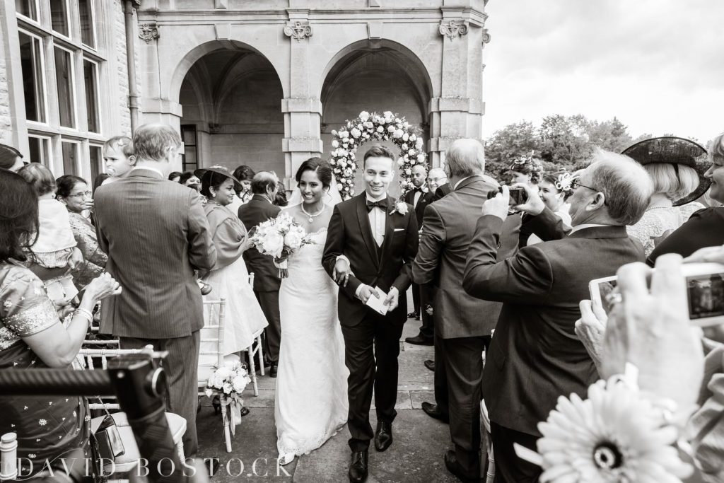 Eynsham Hall Wedding couple on aisle