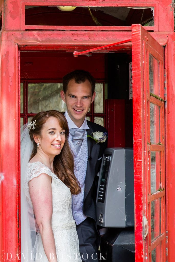 Oxford College Wedding couple in a telephone box