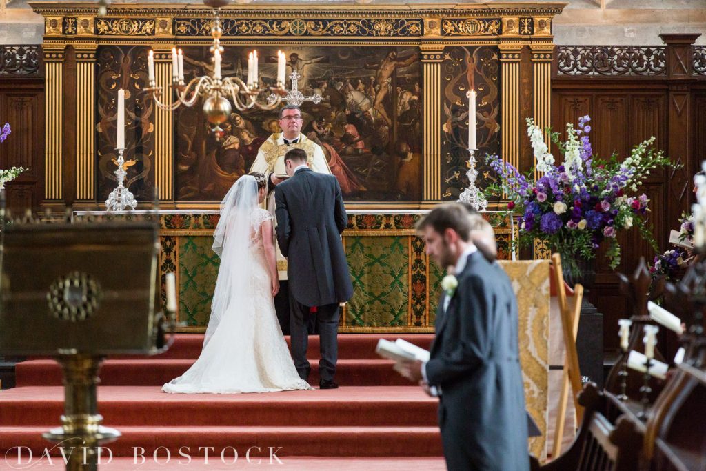 Oxford College Wedding bride and groom at alter