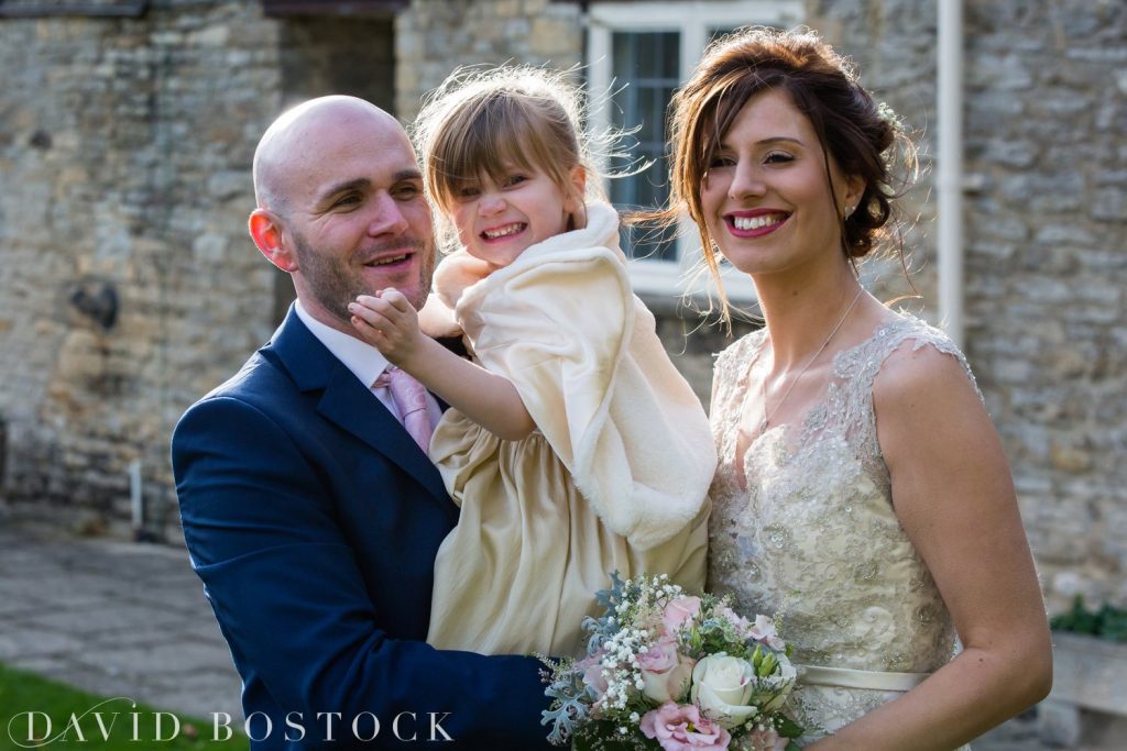 The Great Barn Aynho Wedding Photographs bride and groom with daughter