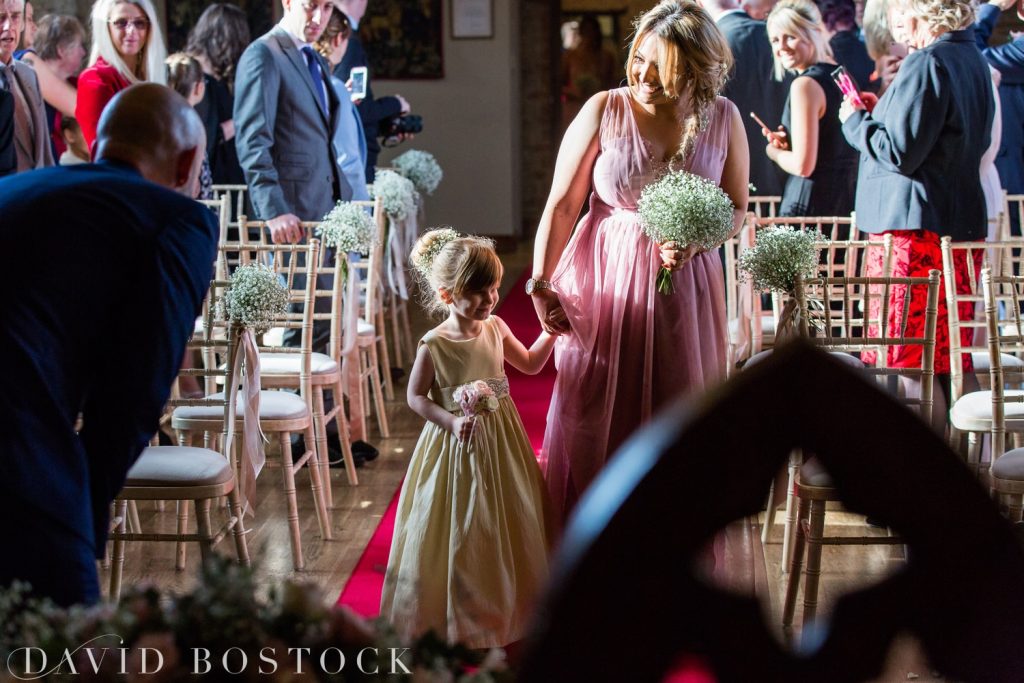 The Great Barn Aynho Wedding Photographs flower girl on aisle 