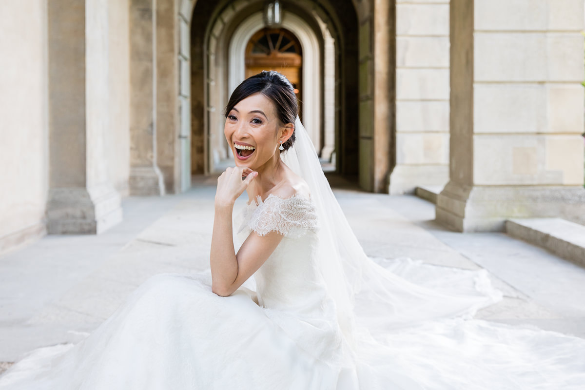 BRIDE LAUGHING AT CLIVEDEN HOUSE