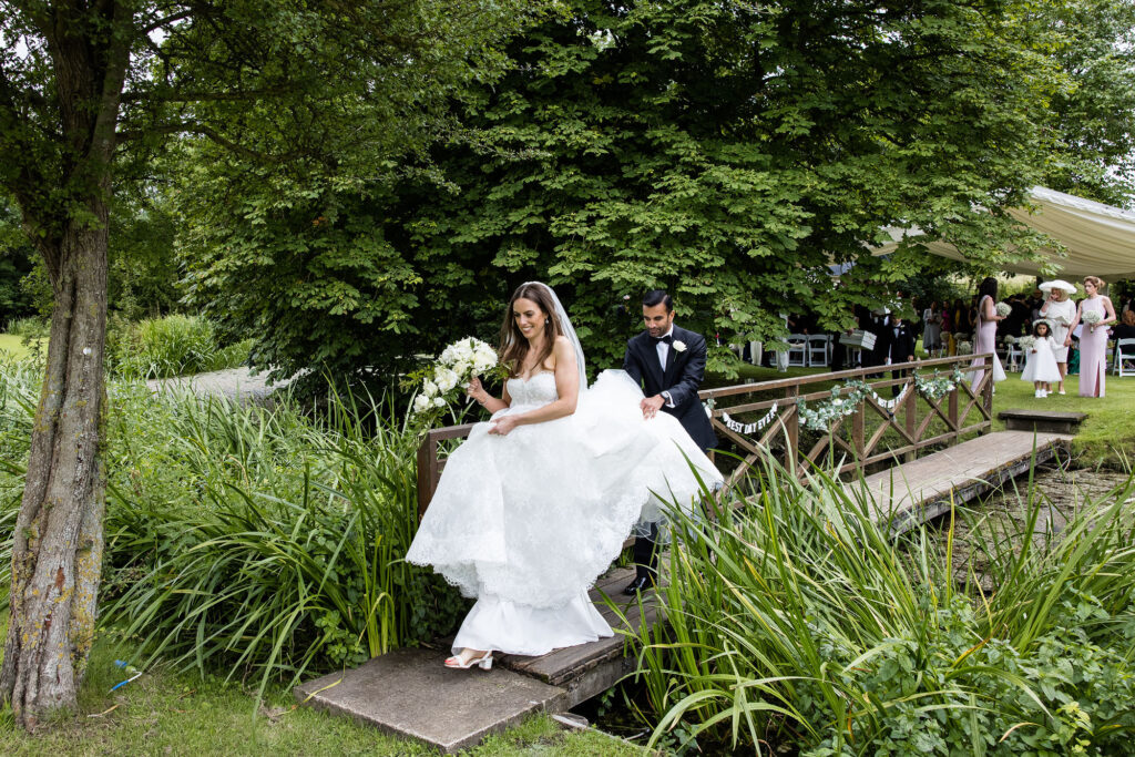 Ardington House wedding photo walking on bridge