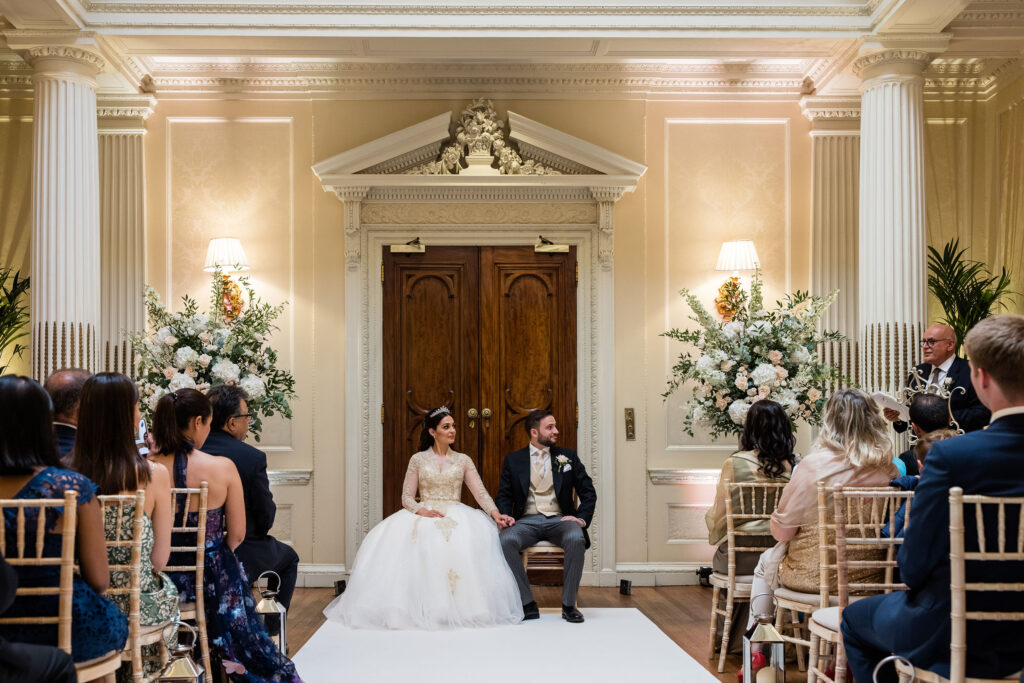 Hedsor House wedding bride and groom sitting down