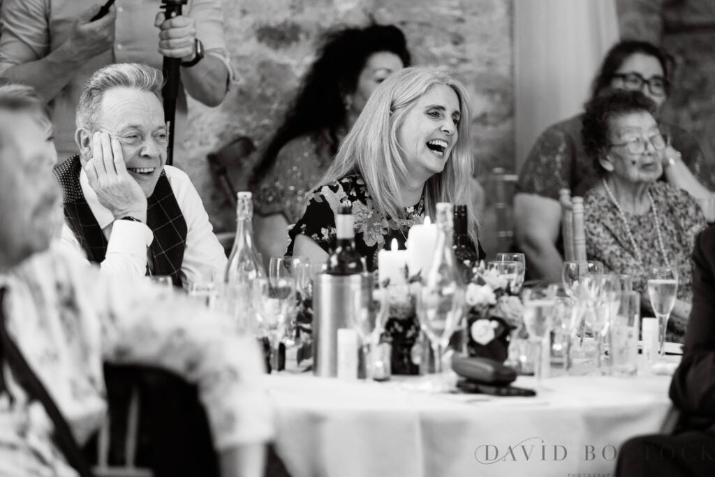 The Great Barn wedding  guests laughing