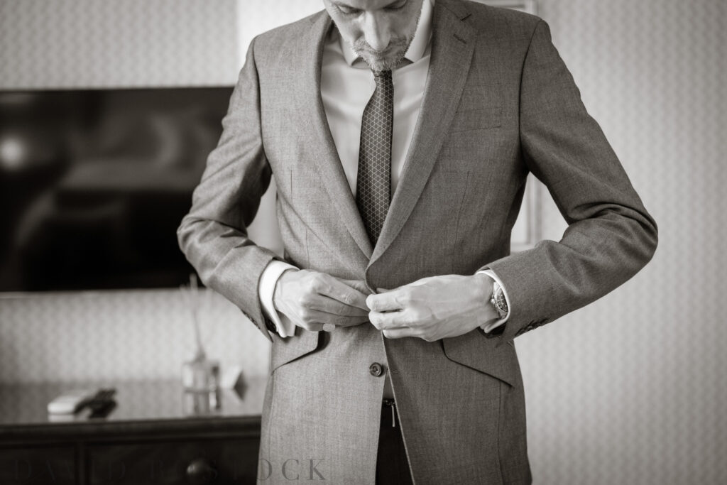 groom getting ready at le Manoir