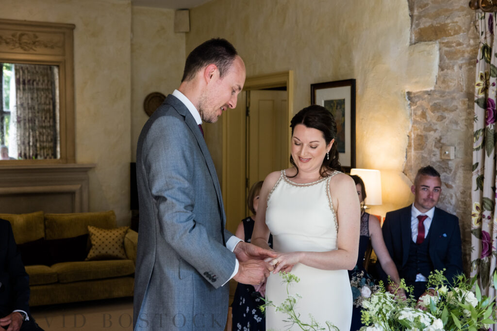 exchanging rings at Le Manoir Aux Quat'Saisons