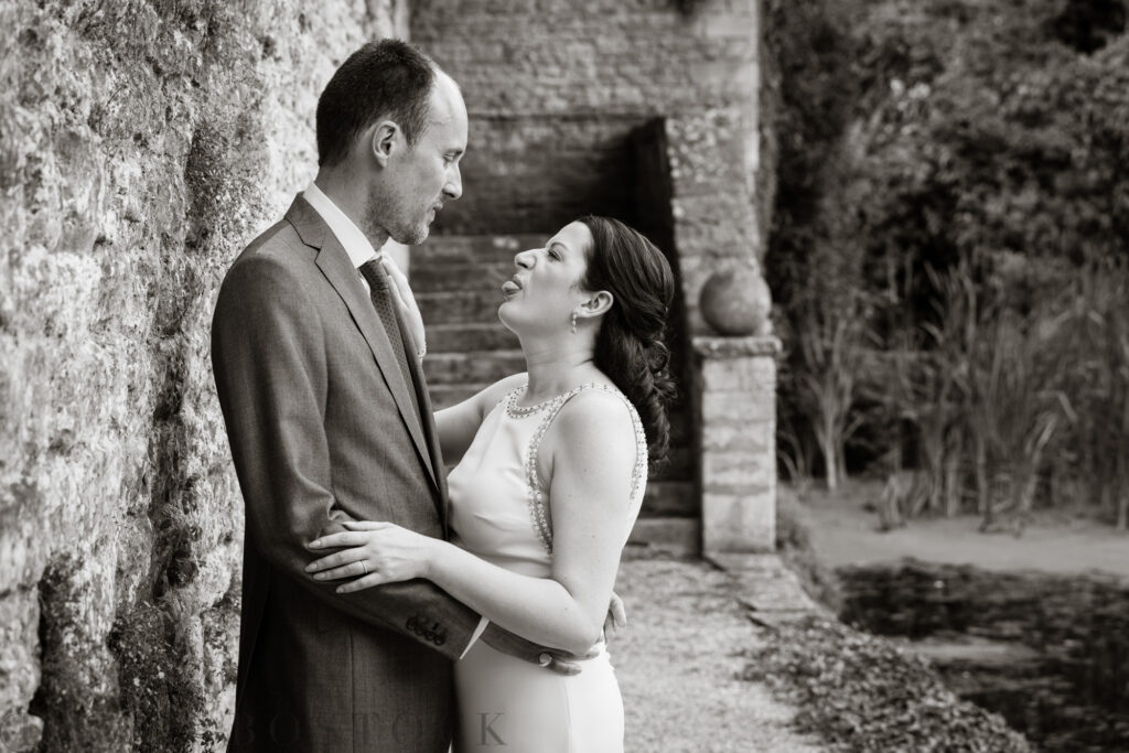 bride sticking out tongue at groom