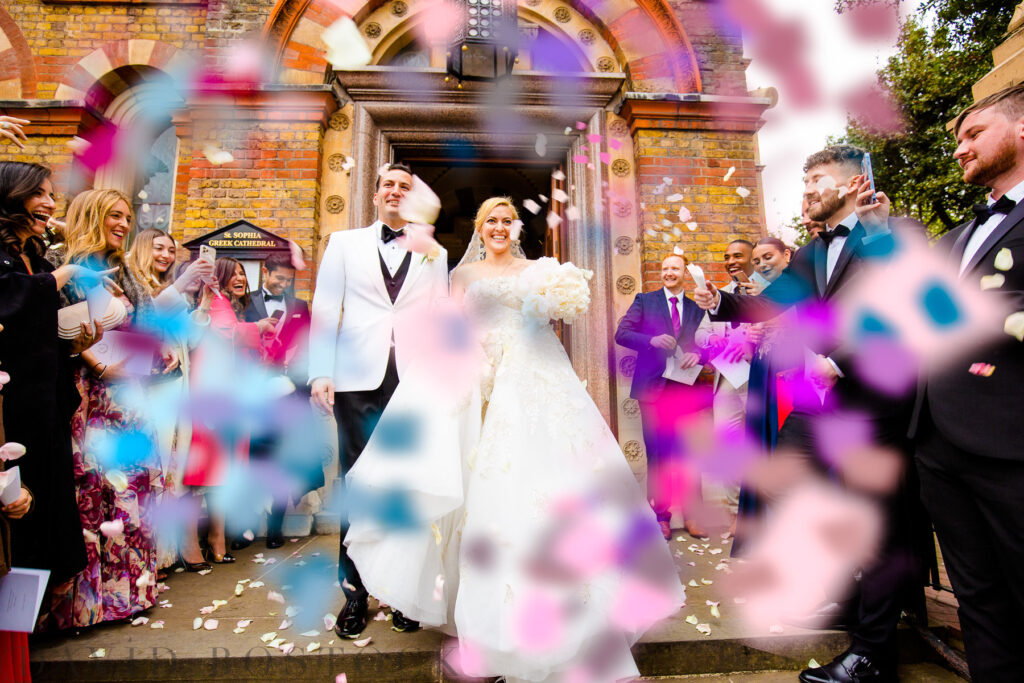 bride and groom covered in confetti