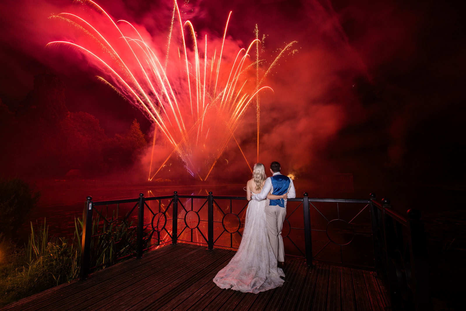 bride and groom watching fireworks