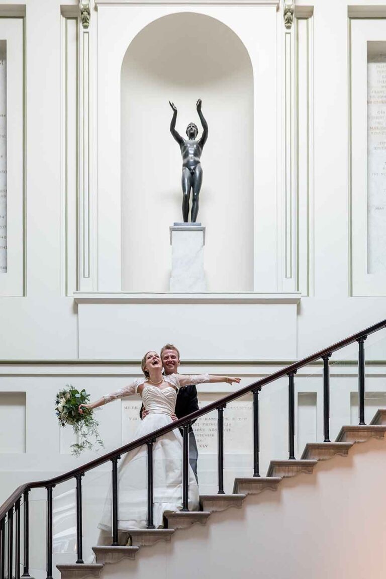 bride and groom on staircase at The Ashmolean