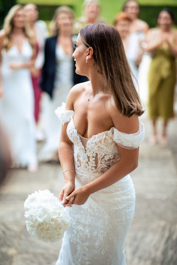 bride getting ready to thro bouquet