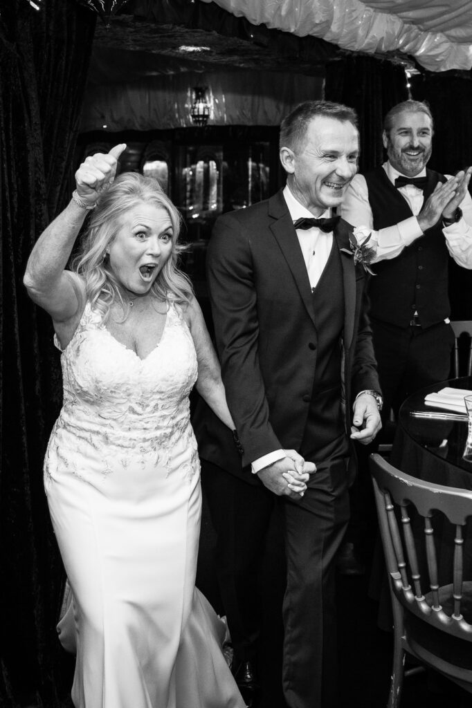 bride and groom walking into their wedding breakfast at The Crazy Bear