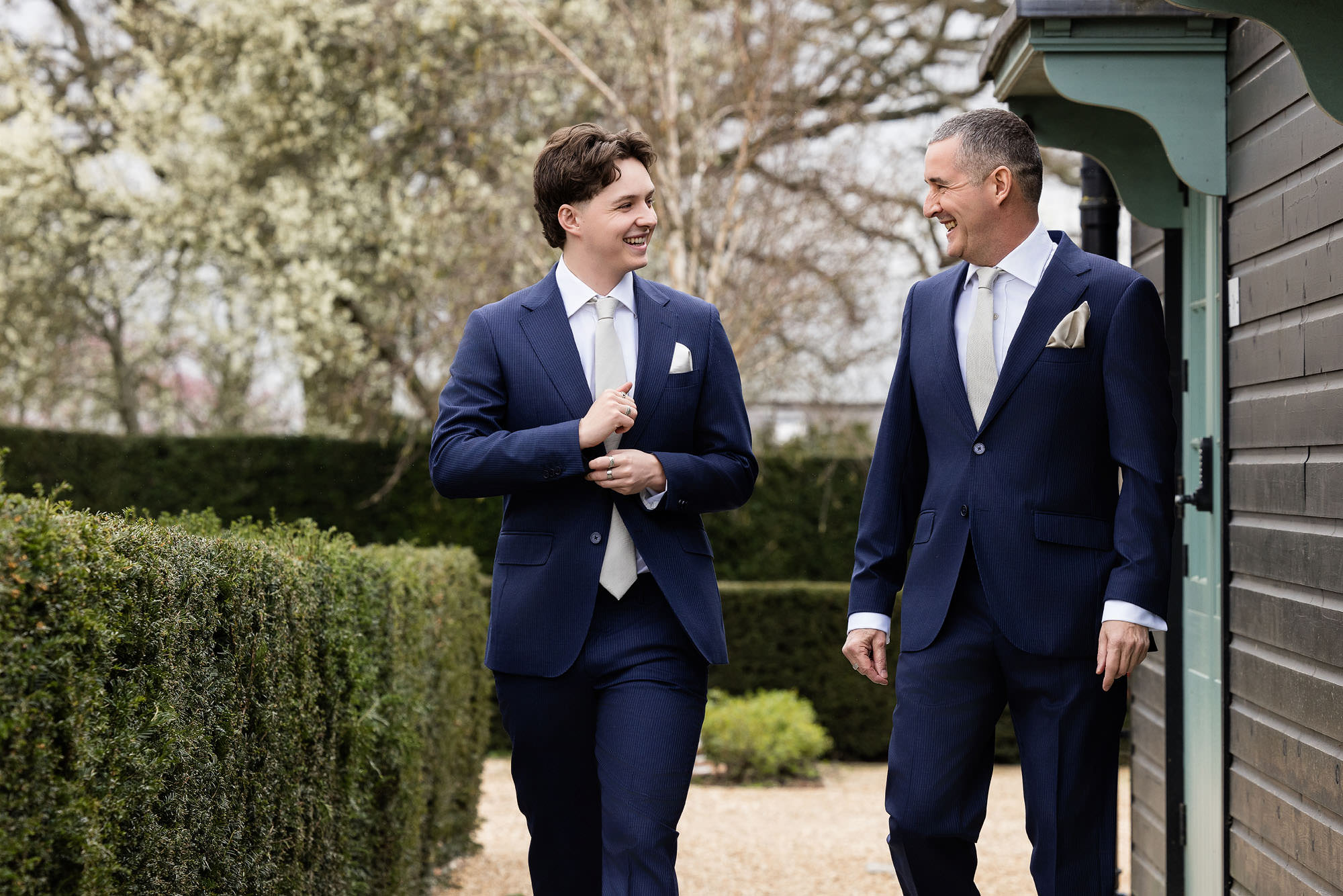 father and son laughing before ceremony
