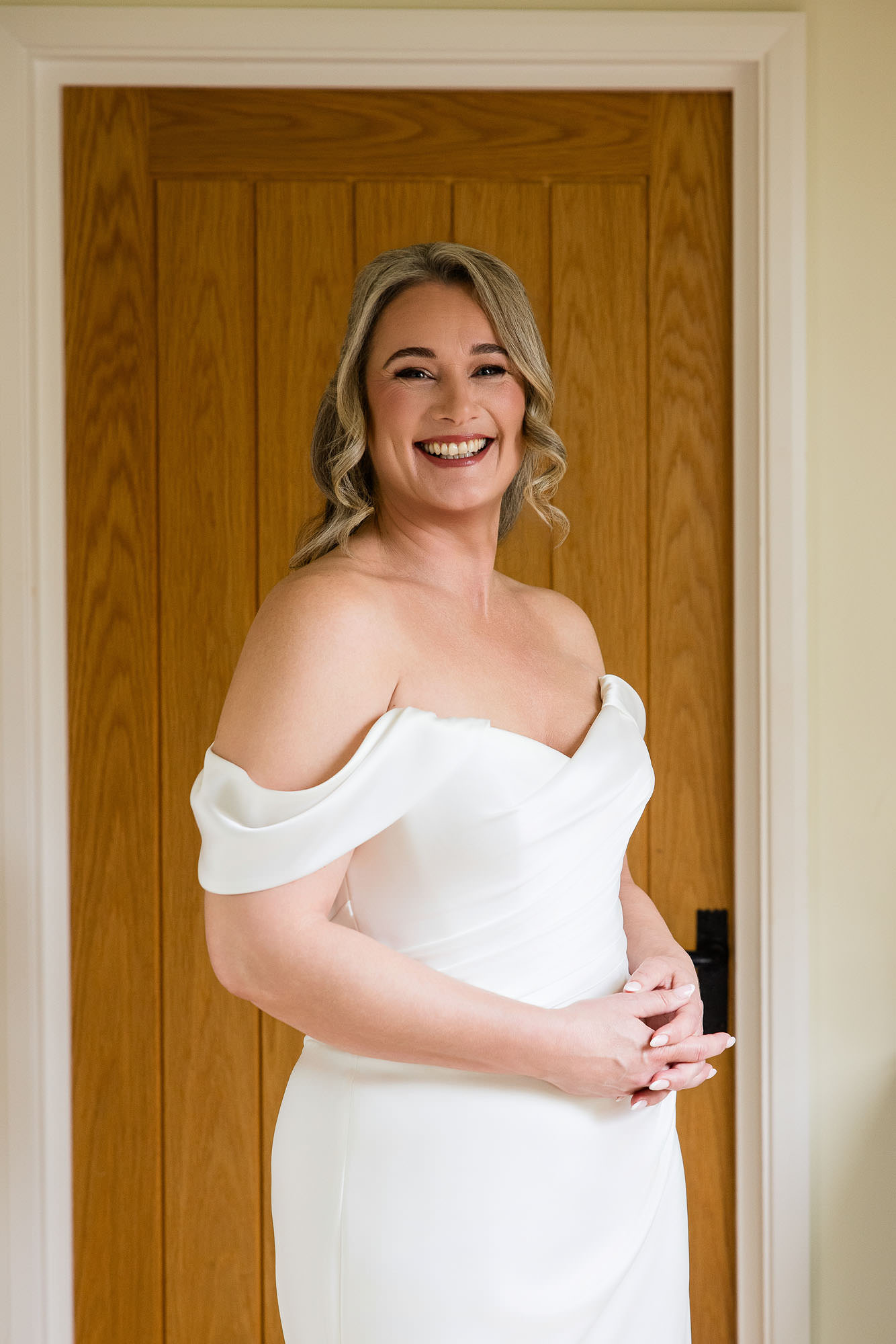 bride smiling in wedding dress