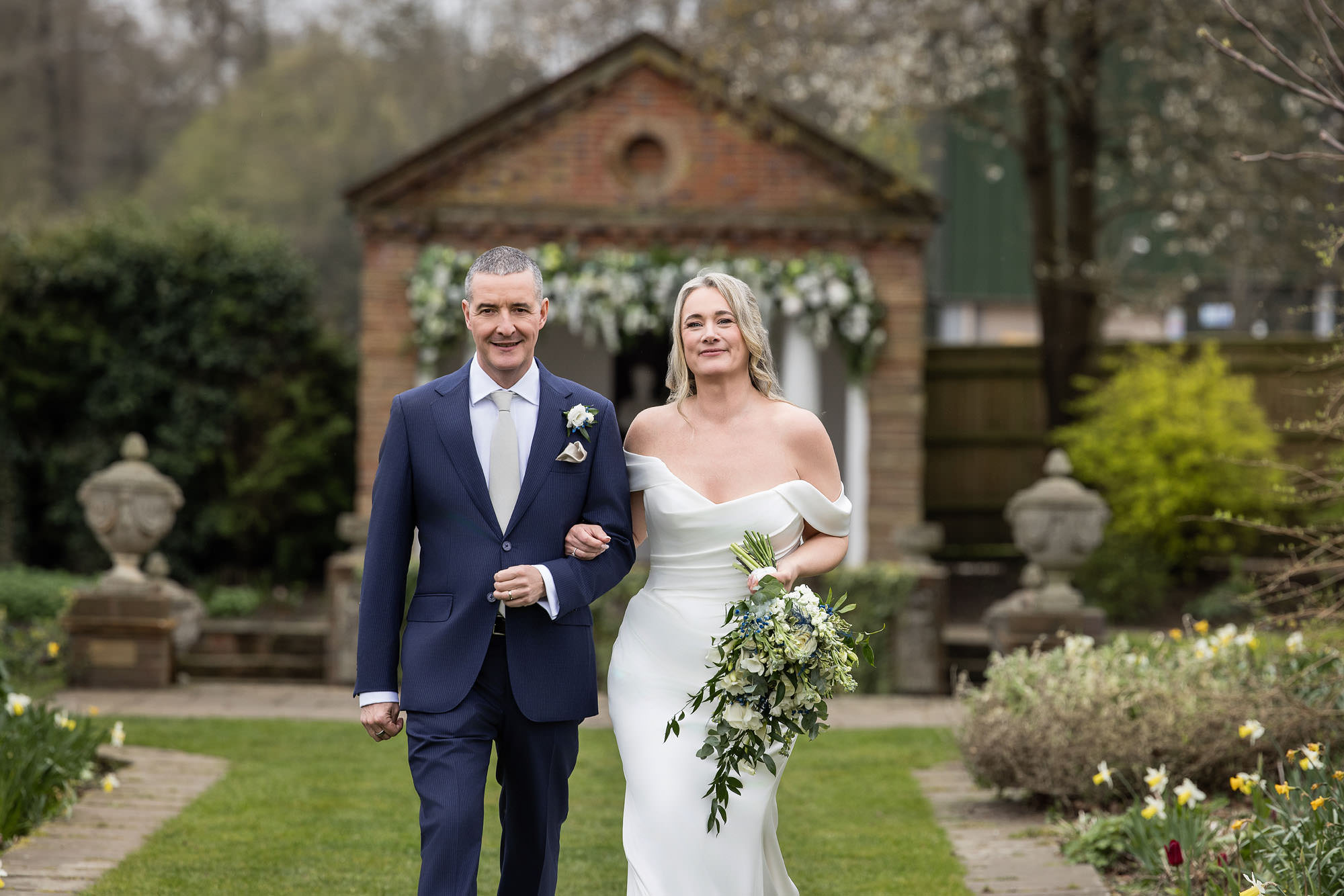 bride and groom walking towards camera