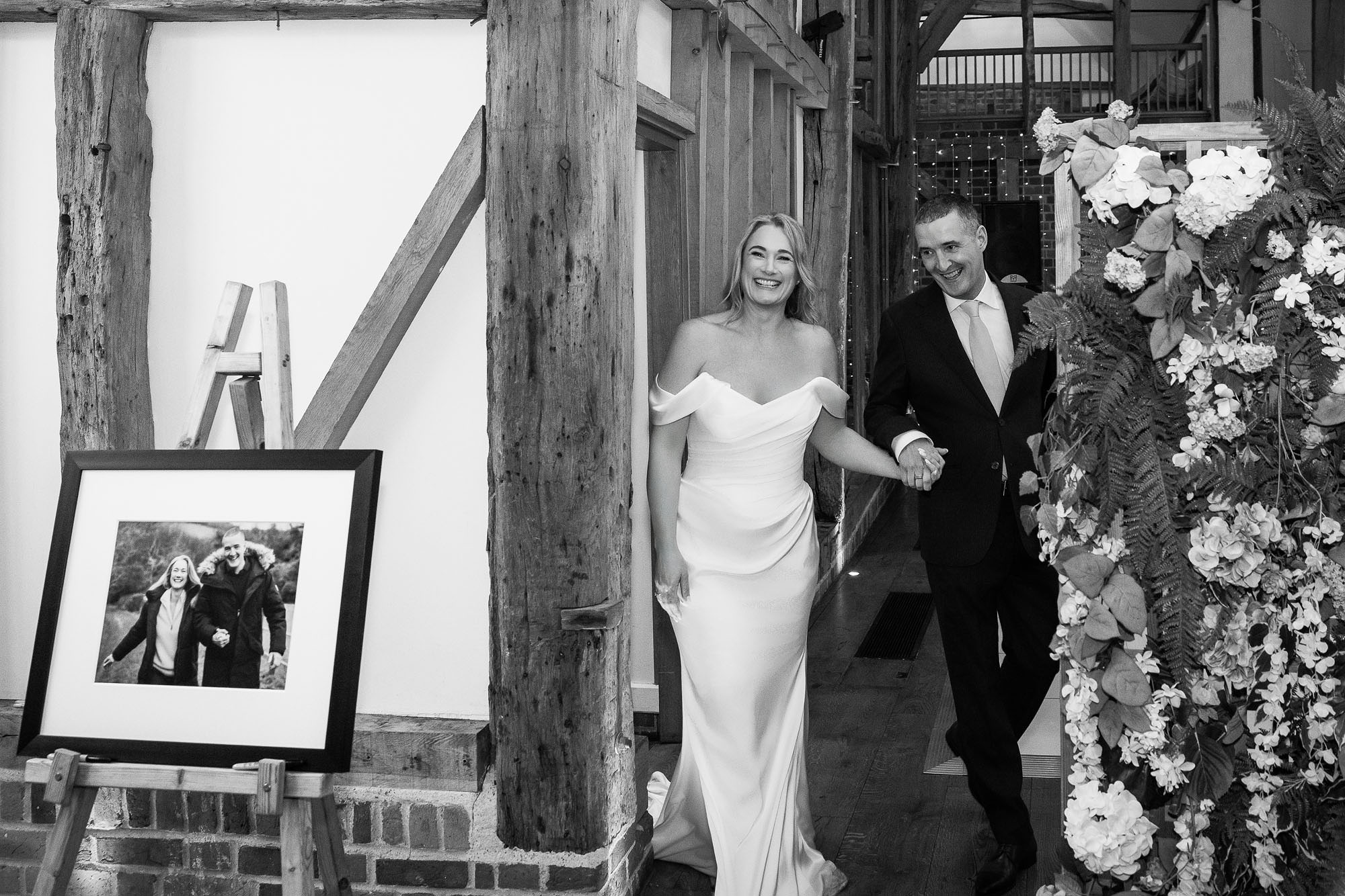 bride and groom walking into reception